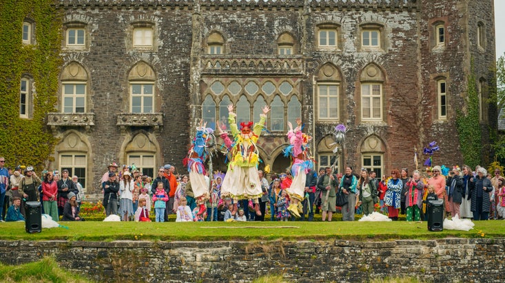 The Mari Ha! dancers perform in the formal garden at Dinefwr and are watched by a large crowd